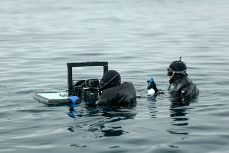 Crew David Reichert and John Chambers film in the water. (National Geographic/Mario Tadinac)