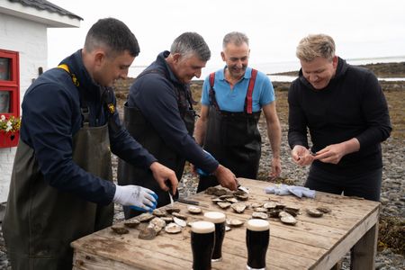 Michael Kelly Jr., Michael Kelly Sr., Diarmuid Kelly and Gordon Ramsay shuck oysters. (National Geographic/Justin Mandel)