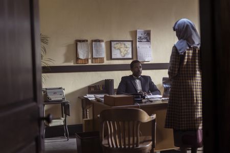 Clyde X, played by Gary Carr, meets with Betty in his office in GENIUS: MLK/X. (National Geographic/Richard DuCree)