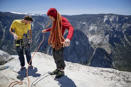 Alex Honnold and Tommy Caldwell organize their climbing gear at the top of the Freerider route on the summit of El Capitan in Yosemite National Park, CA. They had just set a new speed record on the climb. (National Geographic/Jimmy Chin)