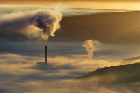 Hope valley and Castleton on a stunning misty morning with the pollution of the local cement factory. (Getty Images/John Finney Photography)