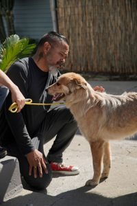 Adrian petting Maverick. (National Geographic)