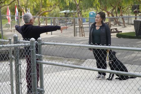 Cesar talks to Bo and her dog Shadow in front of the Serengeti Dog Park. (National Geographic)