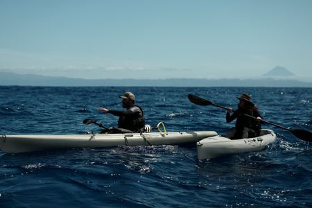 Aldo Kane and Melissa Marquez on kayaks looking for sperm whales. (National Geographic/Mario Tadinac)