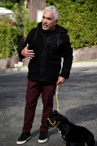 Cesar with Betty on a leash. (National Geographic)