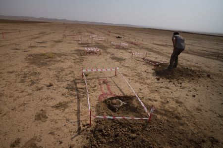 Sinjar, Iraq - An unexploded mine is sectioned off in a minefield. (Sean Sutton)
