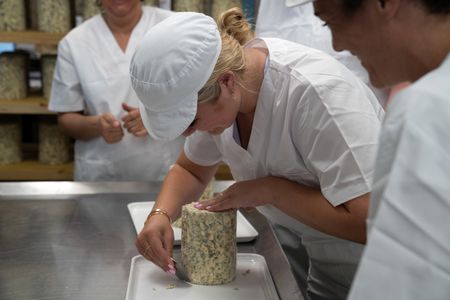 Tilly Ramsay shaves cheese. (National Geographic/Justin Mandel)