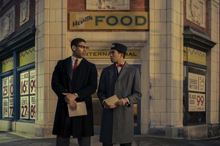 Malcolm X, played by Aaron Pierre, talks with Hinton, played by Xavier Montreal Mills, on the corner outside of Harlem Temple No. 7 in GENIUS: MLK/X. (National Geographic/Richard DuCree)