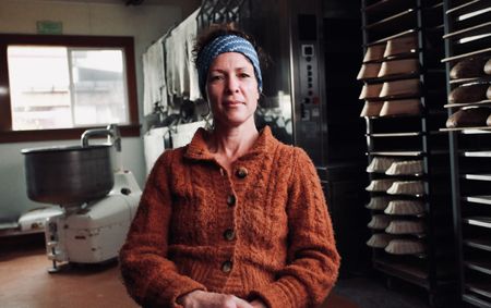 Head baker Celine Underwood poses for a portrait in her kitchen at Brickmaiden Breads in Point Reyes, Calif. (National Geographic/Ryan Rothmaier)