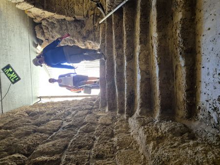 In this behind-the-scenes photo, geoarchaeologist Beverly Goodman and Omry Nackum arrive at the basement of Herod's theatre in Caesarea, Israel. (Windfall Films)