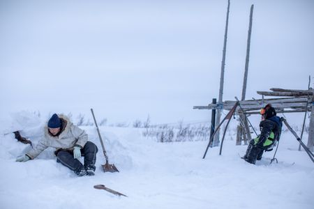 Agnes Hailstone and her grandson, Sabastian shovel snow to prepare their camp. (BBC Studios Reality Productions/Ashton Hurlburt)