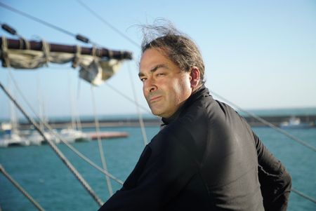 Claudio Lozano stands on the deck of a Puntales ship, standing by the mast. The ship was used to defend against the french navy in the penninsular war in Spain. (National Geographic/Ciaran Henry)