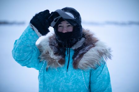 Qutan Hailstone ice fishing with her family. (BBC Studios Reality Productions, LLC/Pedro Delbrey)