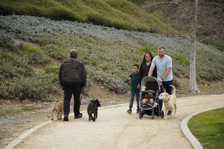 Ashley, Derek, Phoenix and baby Griffin walk with Sansa in an exercise. (National Geographic)