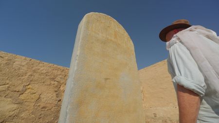 Dr. Jay Silverstein inspects a stele in the Ramesseum in Luxor, Egypt. (Windfall Films)