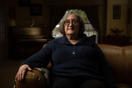 Fran Ferrari is pictured in close-up portrait during the production of National Geographic's Oklahoma City Bombing: One Day In America. Ferrari was at work in the Journal Record building located across the street from the Alfred P. Murrah building and was seriously injured when the explosion shattered the large window in front of her desk. On April 19, 1995, America experienced the deadliest domestic terror attack in its history. Thirty years later, this series tells the story of that day told only by those who lived through it – the people of Oklahoma.  (National Geographic/Brandon Widener)