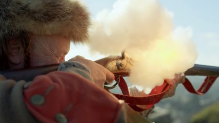 A flint-lock musket is being fired.   (National Geographic)