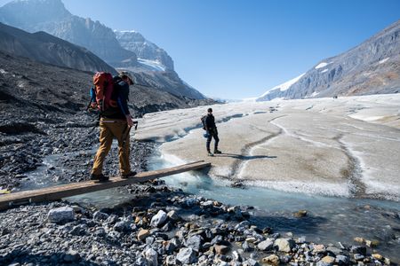 Joseph Fiennes and his guide walk near the Athabasca Glacier.   Sir Ranulph Fiennes, "the greatest living explorer," and his cousin, actor Joseph Fiennes, revisit Ran’s 1971 expedition of Canada’s British Columbia.
