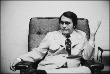 Jim Jones is pictured in his San Francisco office, July 3, 1976. (Photo by Janet Fries/Getty Images)