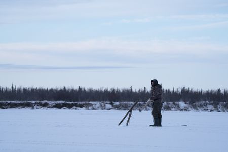 Chip Hailstone installs fish nets under the ice to catch whitefish. (BBC Studios Reality Productions, LLC/Dwayne Fowler)