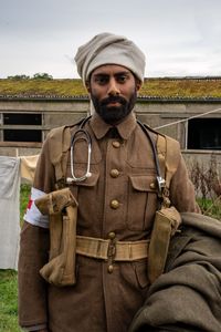Combat Medic Siddiq Ahmed (played by Rishi Rian) poses for a portrait in a historic reenactment scene for "Erased: WWII Heroes of Color," in Norfolk, England. Medic Siddiq Ahmed was a member of Force K6, an Indian Regiment of mule handlers in WW2. Amidst the chaos of Dunkirk and the advancing German Army, one little-known Indian Regiment fights for victory and independence. (National Geographic/Harriet Laws Herd)