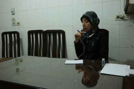 Al Ghouta, Syria - Dr Amani during interview in her office in the hospital. (National Geographic)