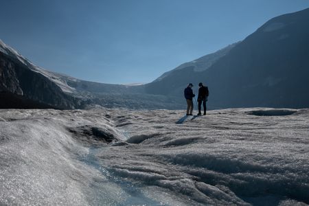 Sir Ranulph Fiennes and Joseph Fiennes stand on the Athabasca Glacier, as they revisit Ran’s 1971 expedition of Canada’s British Columbia. Amidst mountains and whale watching, Sir Ranulph Fiennes and his cousin Joseph Fiennes reflect on Ran’s epic life and his new challenge of life with Parkinson’s. (National Geographic)