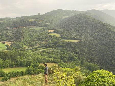 Gerd Serrasolses poses for portrait filming in a vast landscape in Sort, Spain.  (National Geographic/Gene Gallerano)