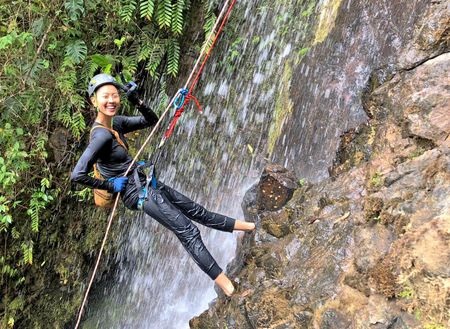 Chef Kristen Kish rappels down a waterfall to collect a type of fresh watercress which only grows in that particular location in Hacienda Mamecillo, Panama. (National Geographic for Disney/Missy Bania)