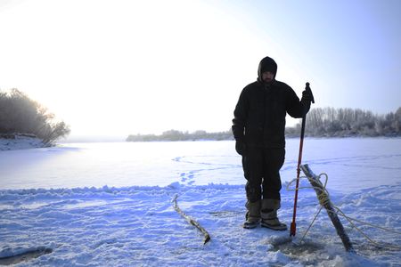 Chevie Roach sets fish nets under the ice during the winter season. (BBC Studios Reality Productions, LLC/Brian Bitterfeld)