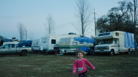 Gridley, CA - Arabella Young, daughter of Kyrstle Young, plays at a Red Cross shelter RV park. (Credit: National Geographic)