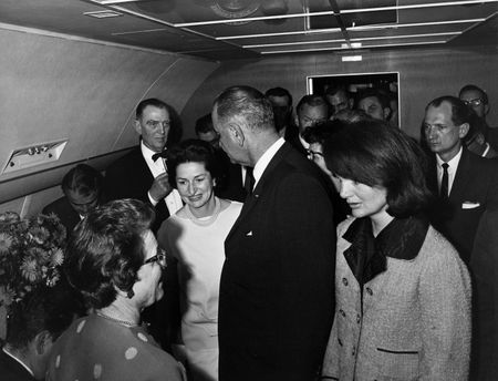 Lyndon B. Johnson is sworn in as President of the United States during ceremony aboard Air Force One, Nov. 22, 1963, in Dallas. Former first lady Jacqueline Kennedy stood beside him during the ceremony. (Cecil Stoughton/White House Photographs/John F. Kennedy Presidential Library and Museum, Boston)