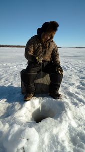 Gage Hoffman ice fishing. (BBC Studios Reality Productions, LLC/Brian Bitterfeld)