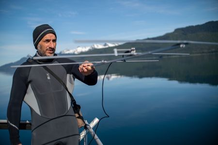 Shark Scientist Yannis Papastamatiou tests the VHF radio tracking antenna. (National Geographic for Disney/Jimmy Cape)
