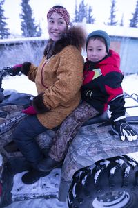 Wade Kelly with his mother, Iriqtaq Hailstone, heading to an elder's home to give away his first ptarmigan. (BBC Studios Reality Productions, LLC/Ashton Hurlburt)