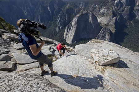 Clair Popkin, Director of Photography on the feature documentary Free Solo, getting the shot of Alex Honnold topping out El Capitan after free soloing the Freerider. (National Geographic/Jimmy Chin)