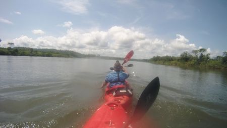 Chris Korbulic, Hendri Coetzee, and Ben Stookesberry kayak single file down a calm section of river.(mandatory photo credit: Benjamin Stookesberry)
