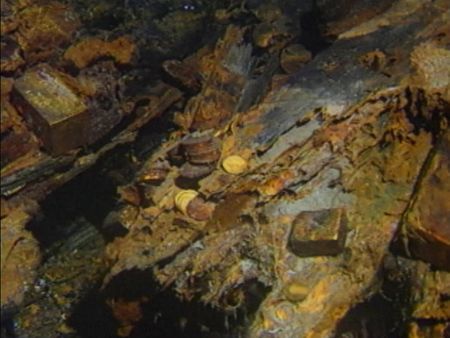 Gold bars and coins are pictured on the bottom of the sea bed off the coast of North Carolina, USA. In 1989, maverick scientist Tommy Thompson stuns the world by recovering three tons of gold from a shipwreck deep in the Atlantic Ocean. What follows is a 30-year story of adventure, deception, and personal turmoil, taking him from venerated celebrity to infamous fugitive, and finally a defiant prisoner who refuses to give up his gold. (Recovery Limited Partnership Liquidating Trust)