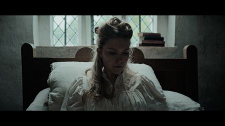 Mary Dunbar sits on her bed looking down in deep thought. (Dash Pictures/Samuel Purcell, Oliver Watts)