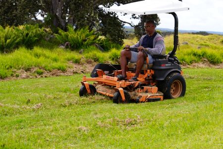 Christian Cooper mows grass at the Hawaii Island Nēnē Sanctuary. (National Geographic for Disney/Troy Christopher)