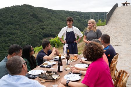 Dario and Tilly speak with their guests at the final cook. (National Geographic/Justin Mandel)