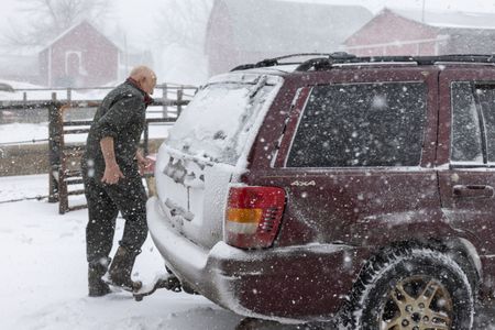 Doc has four-wheel drive as he and Charles head back to the clinic in a snowstorm. (National Geographic/Mike Stankevich)