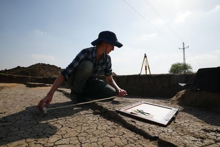 Sara Gebhardt takes measurements at the Pi Ramesses dig site in Egypt. (Windfall Films)