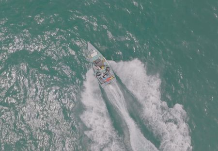 A moving water vessel is seen in aerial, overhead view  in Fajardo, P.R.  (Lucky 8 TV/Ivan Leon)