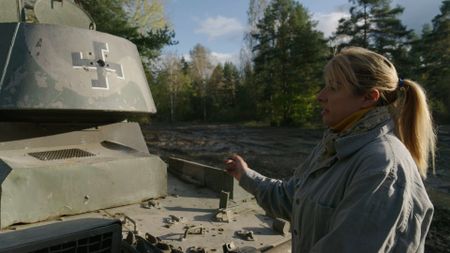 Alex Churchill with a tank. (National Geographic)