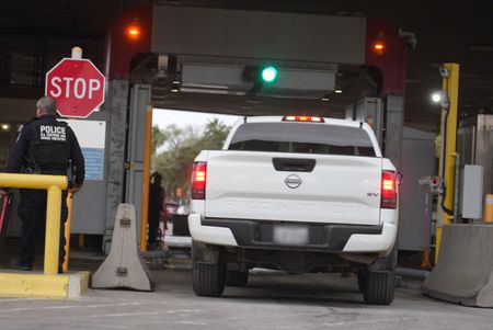 A vehicle drives under a Z-portal X-ray machine to be searched for hid in Brownsville, Texas. (National Geographic)