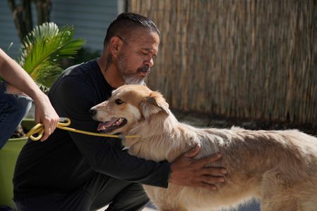 Adrian petting Maverick. (National Geographic)