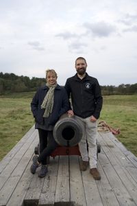 Alex Churchill poses por a portrait with Rob Bibbings of the Trafalgar Gun Company, after firing a replica canon of the type used on HMS Victory during the Battle of Trafalagar. (National Geographic/Jahlani Clarence)