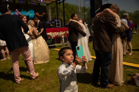 Izaiah Blackwell takes a photo during the elopement festival. Psychologists say viewing a total eclipse can inspire a sense of awe and help inspire a sense of childlike wonder. (Credit: Aaron Huey)