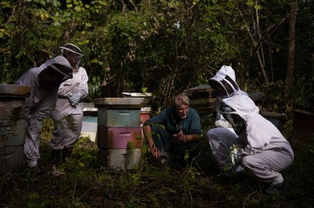 Andy Cory, the Niuean Honey Man, explains the honey harvest in Niue. The island's isolation has protected bees from disease and parasites. The bees play an important role in biodiversity in Niue. (National Geographic/James Peterson)